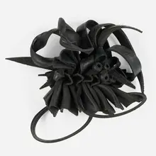 Chakaia Booker, Inanimate Behavior, 2012, rubber tire and wood