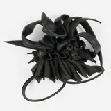 Chakaia Booker, Inanimate Behavior, 2012, rubber tire and wood