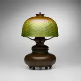 Tiffany Studios and Quezal, Table lamp, c. 1910, patinated bronze, hand-blown glass