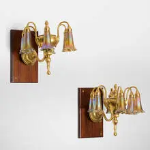 Tiffany Studios, Six-light Lily sconces, pair, c. 1910, gilt bronze, hand-blown Favrile glass