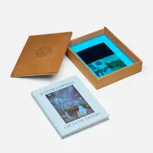 Buzz Spector, Joseph Cornell Gifts of Desire, 1992, wax, ink and gesso on postcards mounted to artist-made cedar box with blue Plexiglas, book