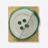 Claes Oldenburg, Broken Button, 1981, dyed and cast paper with screenprint in colors on mat board and wood, contained in a Plexiglas box frame