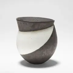 Pot with angled collar by John Ward, circa 1989, Stoneware, alternating bands of black glaze with soft bronze shimmer and white matt glaze, over a softly pitted and text, sold Mar 2026