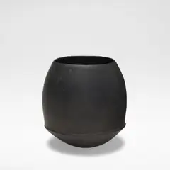 John Ward, Rounded vessel, circa 1980, Stoneware, black textured glaze throughout, the bulbous sides rising from a ridged waist