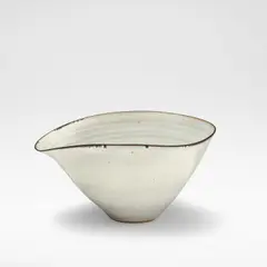 Lucie Rie, Bowl with pouring lip, circa 1959, Stoneware, white glaze with feathered manganese rim