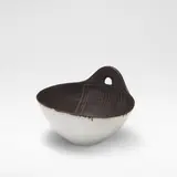 Lucie Rie, Bowl with handle, circa 1958, Stoneware, shiny white glaze with soft brown speckle, the interior with manganese glaze and incised linear sgraffito design