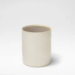 'Cylinder with False Base' by Edmund de Waal, circa 2003, Porcelain, shiny white glaze, the interior with false base and open centre revealing a shiny deep ochre glaze to the int, sold Mar 2026