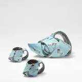 Carol McNicoll, Teapot and two cups, circa 1987, Slipcast earthenware, decorated in blue slip with white and red splashes