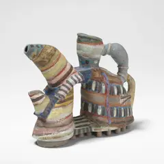 Angus Suttie, 'Fantasy' teapot, circa 1986, Earthenware, painted in vivid polychrome glazes with abstract designs, modelled as a shoe to the base