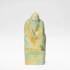 Charles Noke, for Royal Doulton, 1924-1938, Earthenware, blue, green and ochre painted glazes, modelled as a throned figure