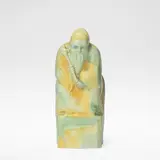 Charles Noke, for Royal Doulton, 1924-1938, Earthenware, blue, green and ochre painted glazes, modelled as a throned figure
