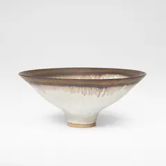 Lucie Rie, Footed bowl, circa 1980, Porcelain, matte white glaze over a softly pitted body