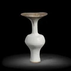 Lucie Rie, Flared vase, circa 1980, Stoneware, white glaze, feathered golden manganese rim with a soft turquoise hue to edges