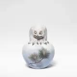 Royal Copenhagen, 'Owl on ball', model no. 1101, circa 1914, Porcelain, decorated in polychrome, the sphere decorated with motifs of pine shoots