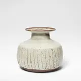 Janet Leach, Large fluted pot, Stoneware, white glaze with iron speckle over a fluted dry brown body, and mottled iron glaze to rim and interior