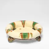 Takeshi Yasuda, 'Fat Rim Dish on Three Feet', 1989, Oxidized stoneware, cream body with poured green and brown Sansai glazes, the feet with combed decoration