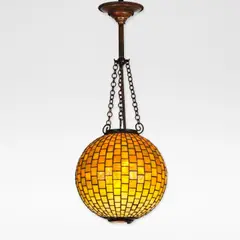 Tiffany Studios, 'Geometric' leaded glass and turtleback chandelier, circa 1910, Leaded glass, patinated bronze, of spherical form, the bottom with a turtleback hatch, suspended on three chains