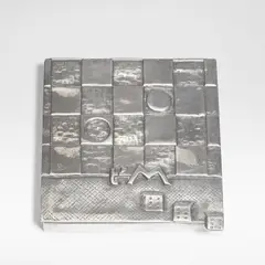 Line Vautrin, 'Je t'aime beaucoup' poudrier, circa 1946, Silvered-bronze, mirror and fabric, the lid modelled in shallow relief with a game board, three dice and 't'M'