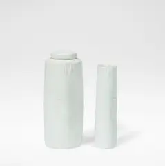 Lidded jar and cylinder by Edmund de Waal, Porcelain, pale blue celadon glazes over softly squeezed bodies, sold Dec 2025