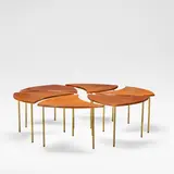 Pinwheel table, model no. 523, designed 1965 by Peter Hvidt & Orla Mølgaard-Nielsen, Teak and brass, in six crescent shaped segments, each raised on tubular brass supports, sold Dec 2025