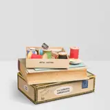 Richard Shaw, Untitled (Stack of Books with Spools of Thread), hand-painted and glazed porcelain, signed and dated on underside