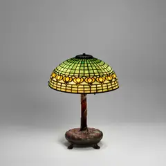 Tiffany Studios, 'Pomegranate' Table Lamp, leaded glass, patinated bronze, shade tag stamped 'TIFFANY STUDIOS NEW YORK,' base stamped '6844 TIFFANY STUDIOS NEW YORK'