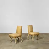 John Dickinson, Pair of 'Etruscan' Chairs, carved walnut, craquelure paint, calf leather upholstery