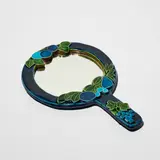 Mithé Espelt, Face à main, A hand mirror in glazed earthenware and mirrored glass by Mithé Espelt circa 1990