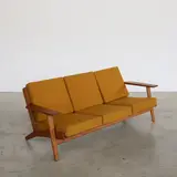 Canapé GE290 by Hans J. Wegner, An impressed 'GE290' sofa in iroko and fabric designed by Hans J, sold Apr 2026