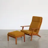 Fauteuil GE290A et son ottoman by Hans J. Wegner, An impressed 'GE290A' armchair and its ottoman in black cherry and fabric designed by Hans J, sold Apr 2026