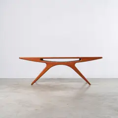 Table basse 206A dite Smile by Johannes Andersen, A labeled '206A' coffee table, also called 'Smile' in tinted ash designed by Johannes Andersen circa 1957 and executed b, sold Apr 2026