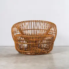 Travail Italien, Fauteuil, An Italian armchair in rattan circa 1950