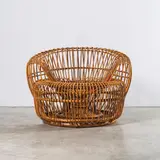 Travail Italien, Fauteuil, An Italian armchair in rattan circa 1950