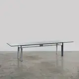 Table Doge by Carlo Scarpa, A 'Doge' table in brushed steel and glass designed by Carlo Scarpa in 1968 and edited by Studio Simon for Dino Gavina, offered Apr 2026