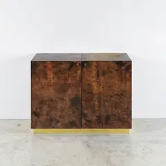 Bar by Aldo Tura, A labeled bar in varnished parchment, wood, brass, mirrored glass and plywood by Aldo Tura circa 1970, sold Apr 2026