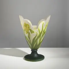 Vase sur piédouche by Établissements Gallé, A signed vase on pedestal in acid-etched multilayered glass with a rotating iris blossoms decoration by Établissements G, sold Apr 2026