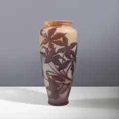 Vase de forme balustre by Établissements Gallé, A signed baluster-shaped vase in acid-etched multilayered glass with a rotating clematis blossom decoration by Établisse, sold Apr 2026