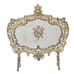 Pantalla Para Chimenea, FRANCIA, CA., 1900, Bronce, acabado dorado; decoración profusamente calada, diseños a manera de acantos, mascarón y cabezas femeninas; pantalla metálica con medallón central