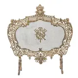 Pantalla Para Chimenea, FRANCIA, CA., 1900, Bronce, acabado dorado; decoración profusamente calada, diseños a manera de acantos, mascarón y cabezas femeninas; pantalla metálica con medallón central