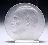 René Lalique (French, 1860-1945), A 'Louis Pasteur' Portrait Medallion by René Lalique, glass, moulded R Lalique mark, in the original fitted box, the edge moulded Louis Pas, sold May 2023