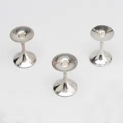 A set of three candlesticks, Trumpet, Kultakeskus, Hämeenlinna 1990s-2010s by Tapio Wirkkala, silver, offered Sep 2026