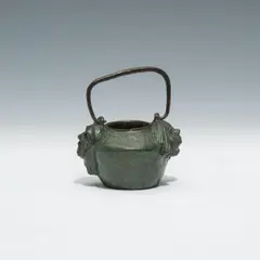 Gustav Gurschner, Small pot with handle "Theatermasken, Bronze, patinated; signed "GURSCHNER/VIENNE" below one head.
