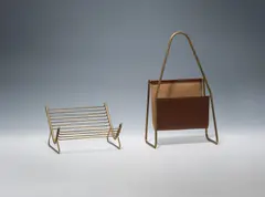 Newspaper rack and book holder by Carl Auböck, sold Jun 2023
