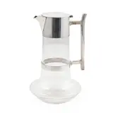 DECANTER, CIRCA 1880 by Christopher Dresser, 1880, silver plate, sold Oct 2024