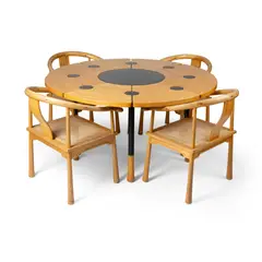 'YIN AND YANG' DINING SUITE by Richard Nissen, beech and cane with black lacquered steel fittings, offered Apr 2024
