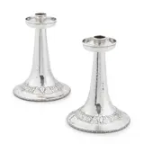 A. E. Jones, MATCHED PAIR OF ARTS & CRAFTS 'WITCHING HOUR' CANDLESTICKS, CIRCA 1912