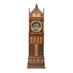 J.H. Chamberlain, GOTHIC REVIVAL LONGCASE CLOCK, CIRCA 1878, 1878, carved oak and walnut