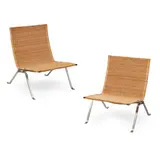 Pair of 'PK22' Lounge Chairs by Poul Kjaerholm, steel and woven wicker, sold Apr 2023
