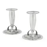 Archibald Knox, PAIR OF 'TUDRIC' BULLET CANDLESTICKS, CIRCA 1900