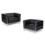 Le Corbusier, Pair of 'LC3' Armchairs, black leather and polished chrome steel
